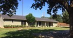 Mineola, Texas house after remodeling with new lawn