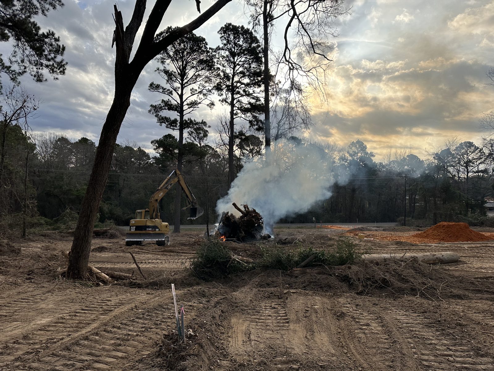 Burning brush piles while clearing land in Wood County, Texas