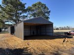 Finished metal pole barn for tractors and ATVs in East Texas