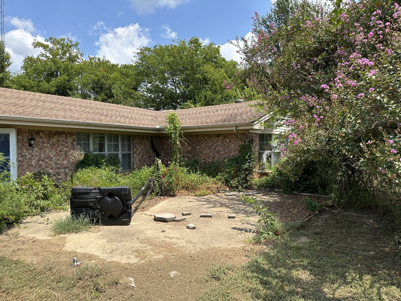 Back of the Hopkins County house before the remodel