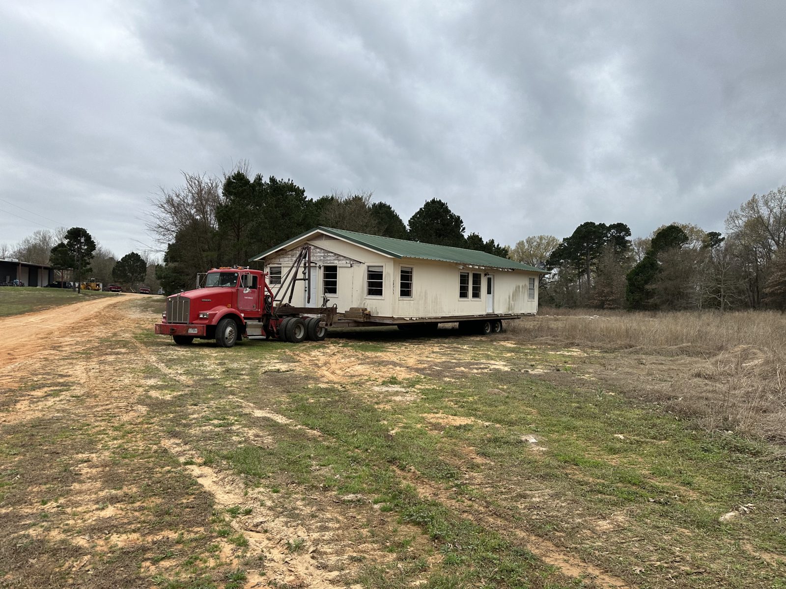 Little frame house loaded on a moving truck near Pine Mills, Texas