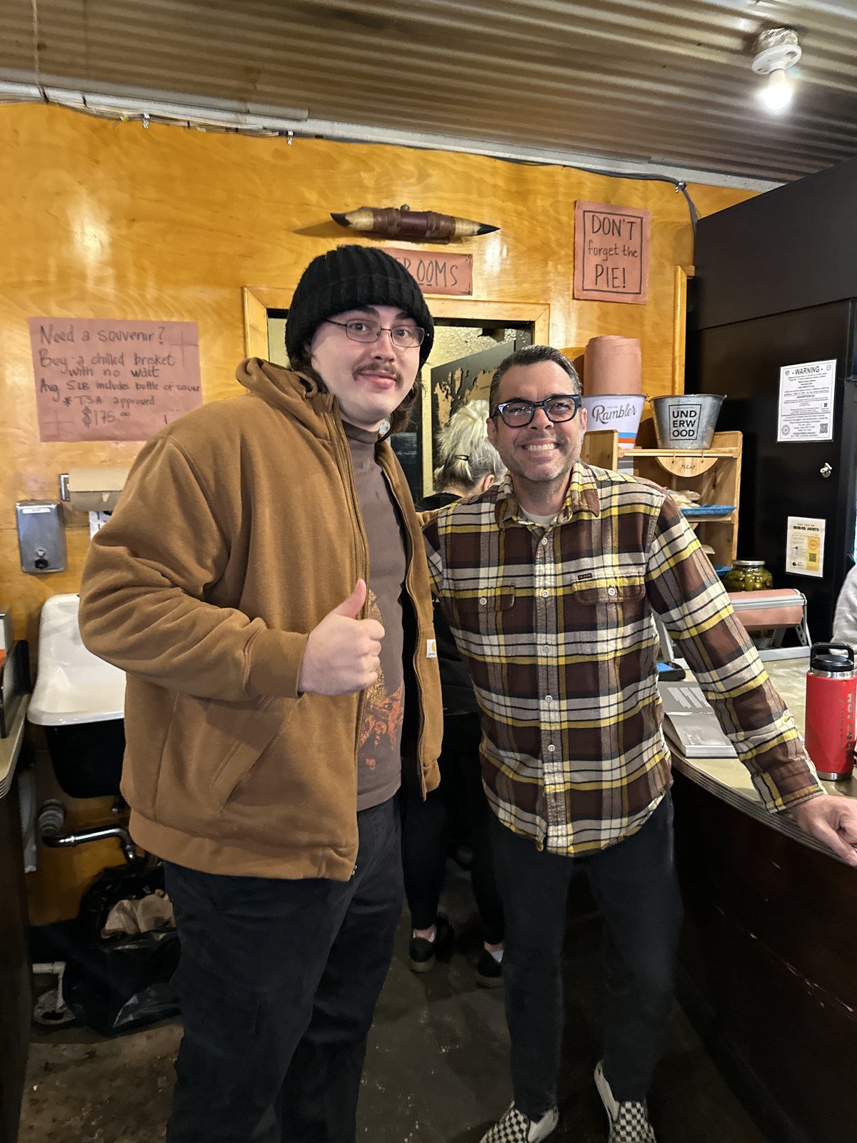 Greg McKinney's son meeting Aaron Franklin at Franklin Barbecue