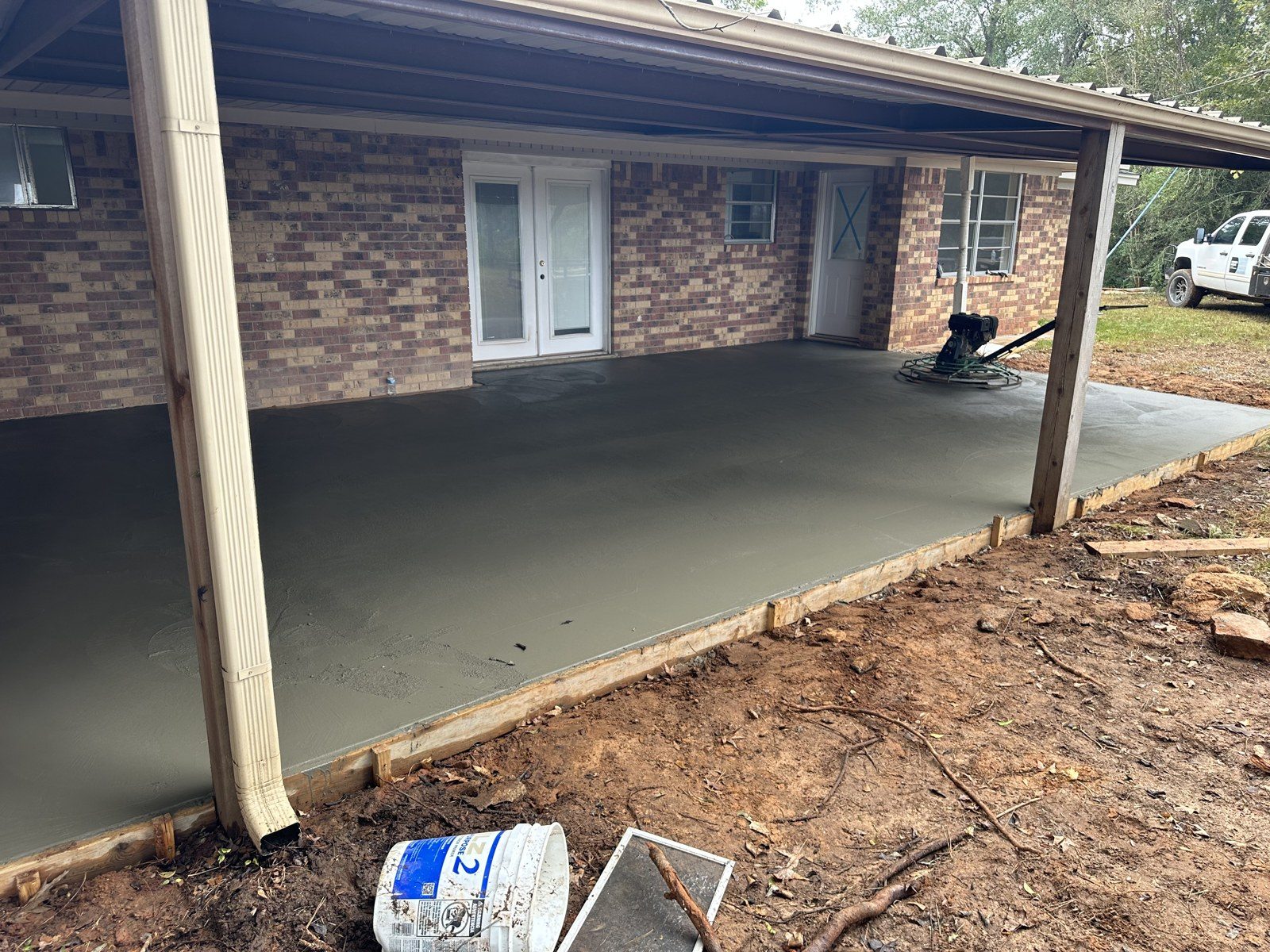New concrete patio finished under the covered porch