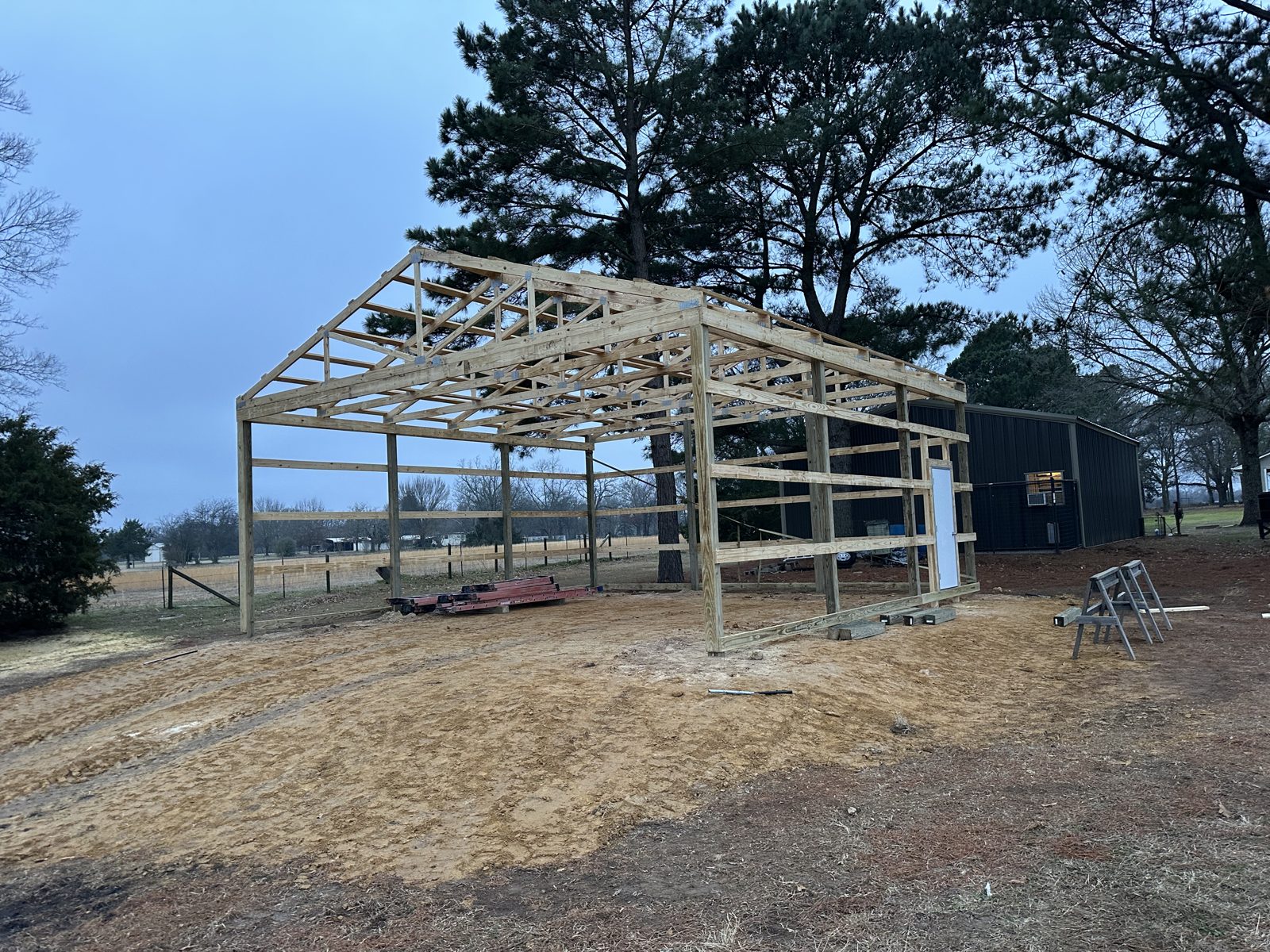 Pole barn framing going up in East Texas