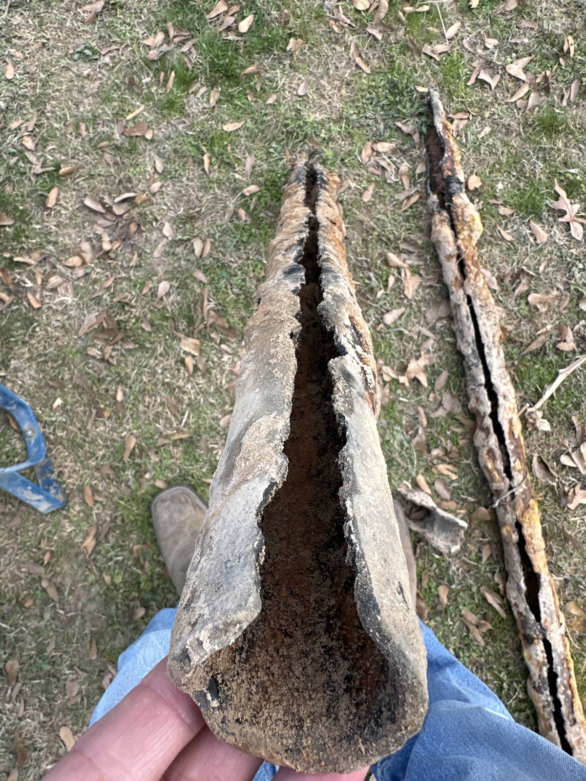 Rusted out cast iron drain pipe removed from under a house