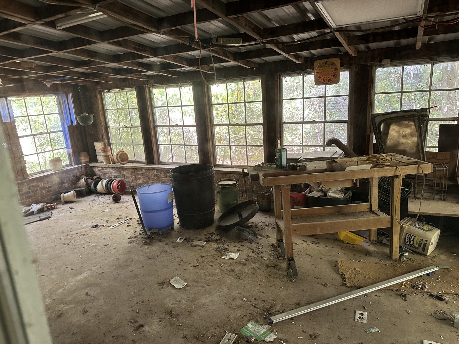 Sunroom full of junk before the remodel